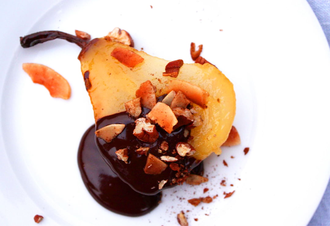 Honey-roasted pears with chocolate fudge sauce and pecan sprinkle